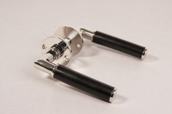 Door handle Bauhaus round shiny nickel and black ebony with rosettes per pair