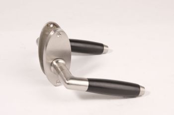 Door handle barrel model brushed nickel and ebony spacer pair with oval rosettes