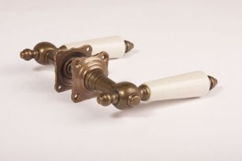 Door handles classic bronze antique with antique white porcelain and two rosettes