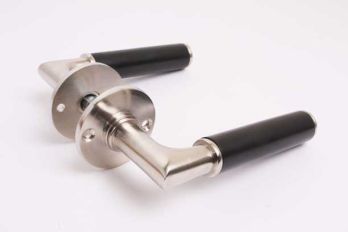 Door handle Bauhaus round brushed nickel and black ebony with rosettes per pair