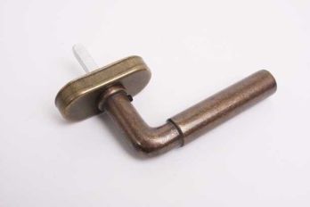Window handle for turn-tilt windows Bauhaus round bronze antique