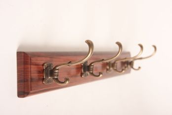 Coat rack with four classic hooks bronze antique on rosewood