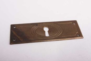 Key plate antique bronze for a drawer cross 32 mm